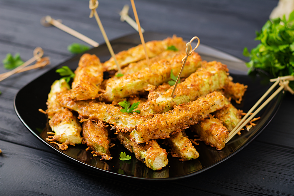 These baked zucchini fries are a perfect example of how simple ingredients can transform into a satisfying and nutritious dish. Zucchini is a low-calorie, fiber-rich vegetable that provides essential vitamins and minerals. The combination of nutritional yeast and breadcrumbs gives the fries a cheesy, savory flavor without using dairy, making them completely vegan. Plus, baking instead of frying makes this recipe much healthier and lighter while still maintaining the desired crispy texture.